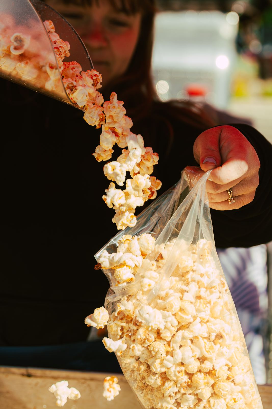 Classic kettle corn pouring into a bag