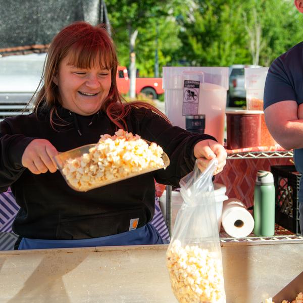 Bagging fresh kettle corn at the booth