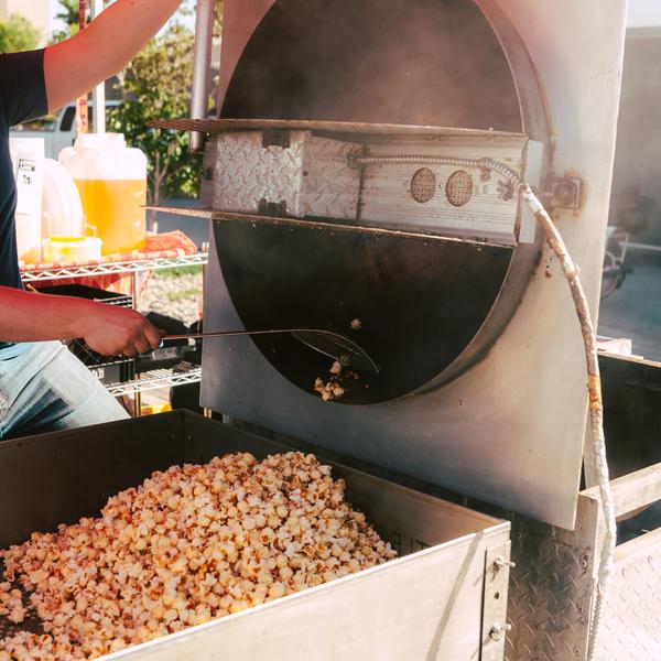 Steam rising from the kettle under the red tent