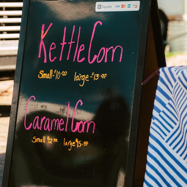 Chalkboard menu with kettle corn and caramel corn prices